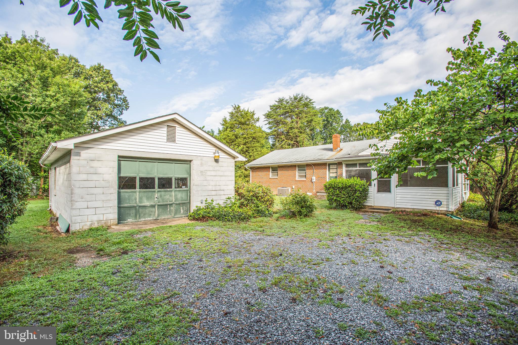 11358 Ridge Road King George, VA 22485 - Photo 31 of 31 Oversized garage with workbench and shelves