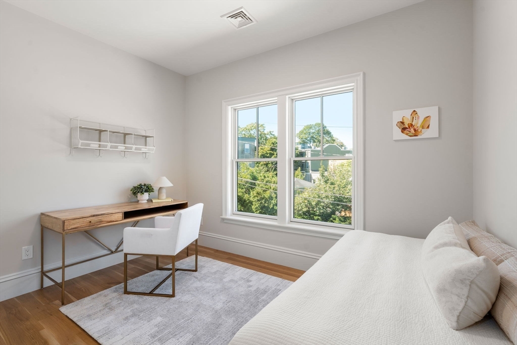 69 Williams Street, Unit 3 Boston, MA 02130 - Photo 18 of 22 a bedroom with a bed and a window