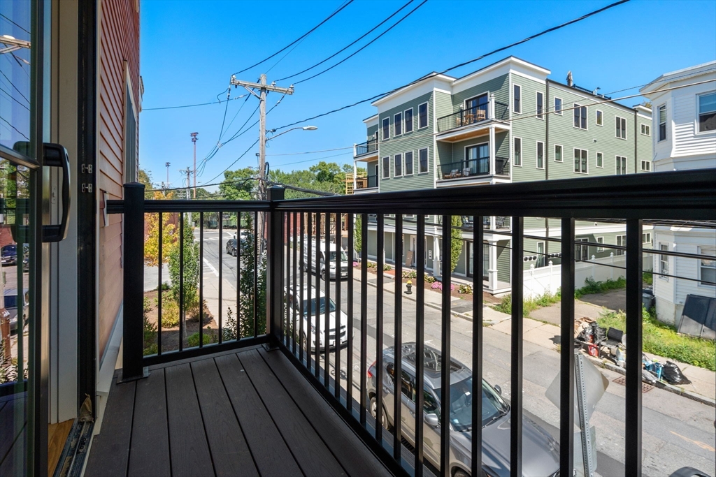 69 Williams Street, Unit 3 Boston, MA 02130 - Photo 22 of 22 a view of a balcony with wooden floor