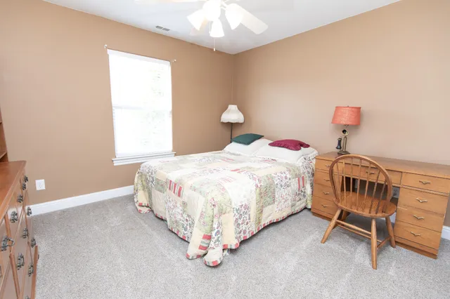 a kitchen with stainless steel appliances granite countertop a sink refrigerator and cabinets