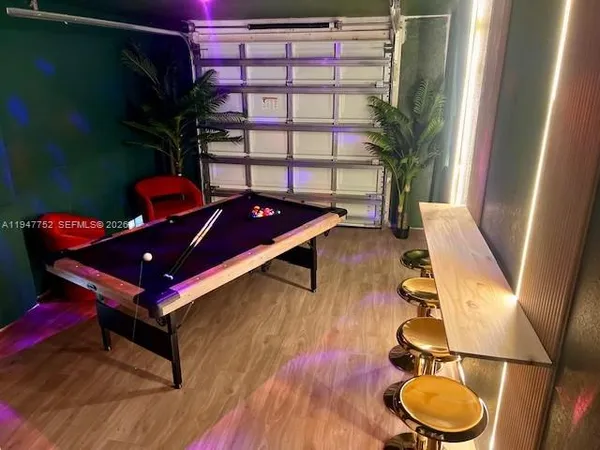 a room with furniture and a potted plant
