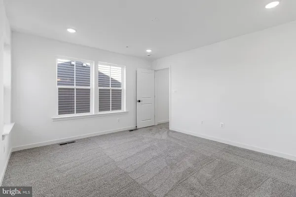 a bathroom with double sink and a mirror