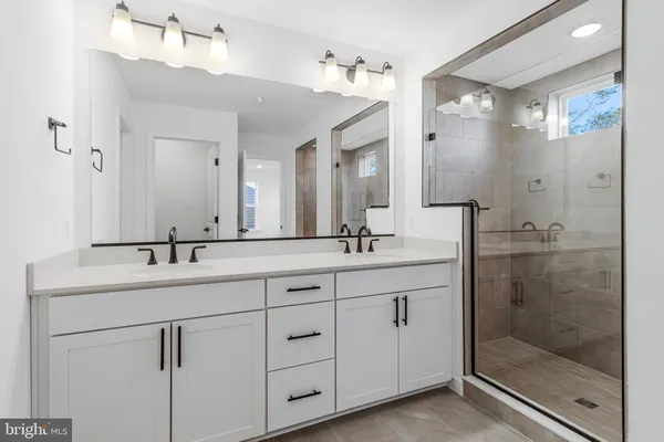 a bathroom with a glass shower door