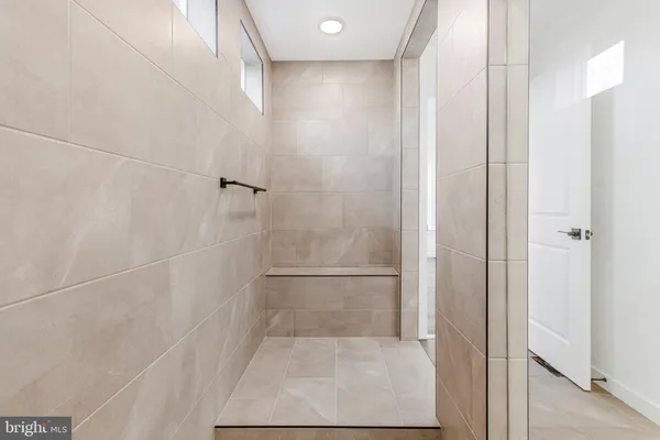 a view of staircase with white walls and a window