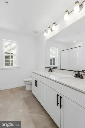 a view of a hallway with white walls