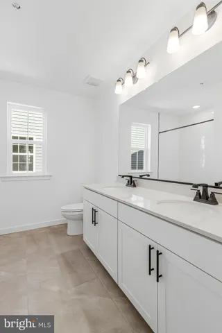 a view of a hallway with white walls