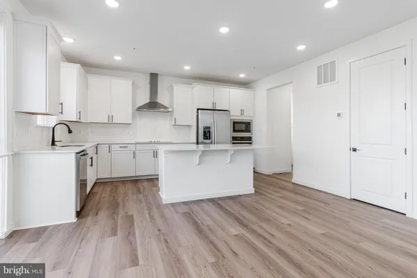 a large kitchen with cabinets