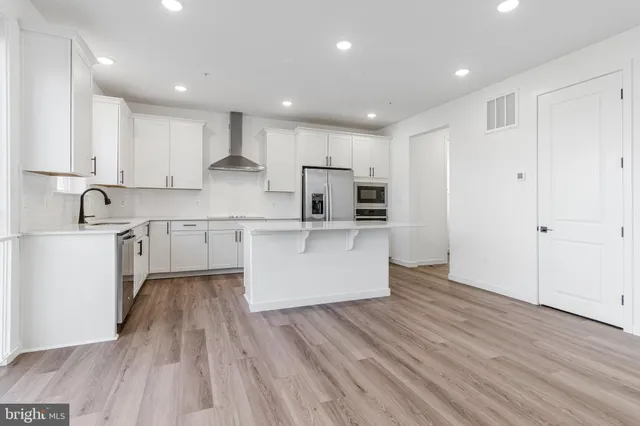 a large kitchen with cabinets