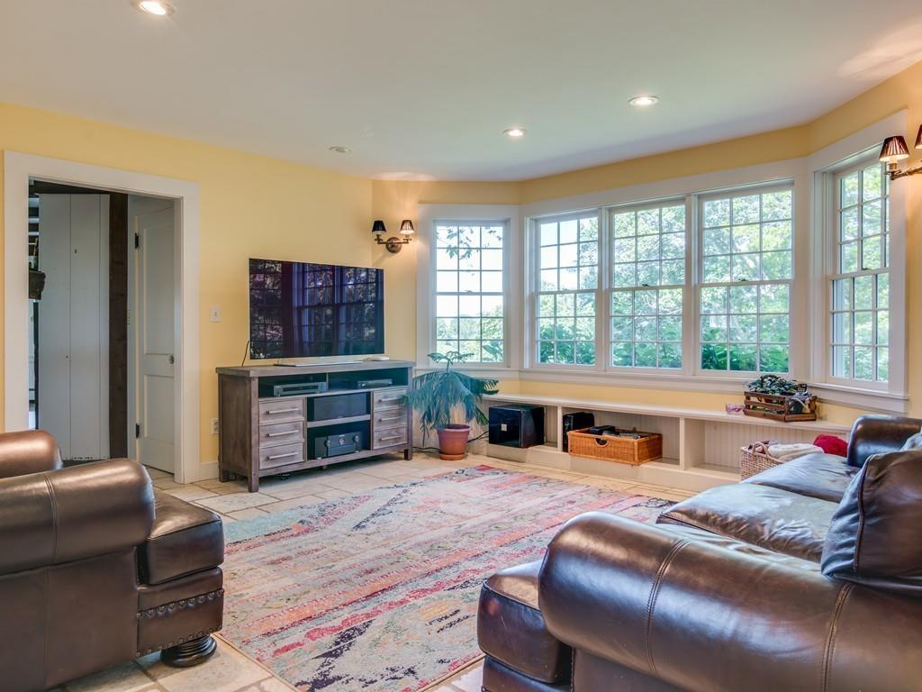 5 Way Road Gloucester, MA 01930 - Photo 13 of 24 a living room with furniture a flat screen tv and a large window