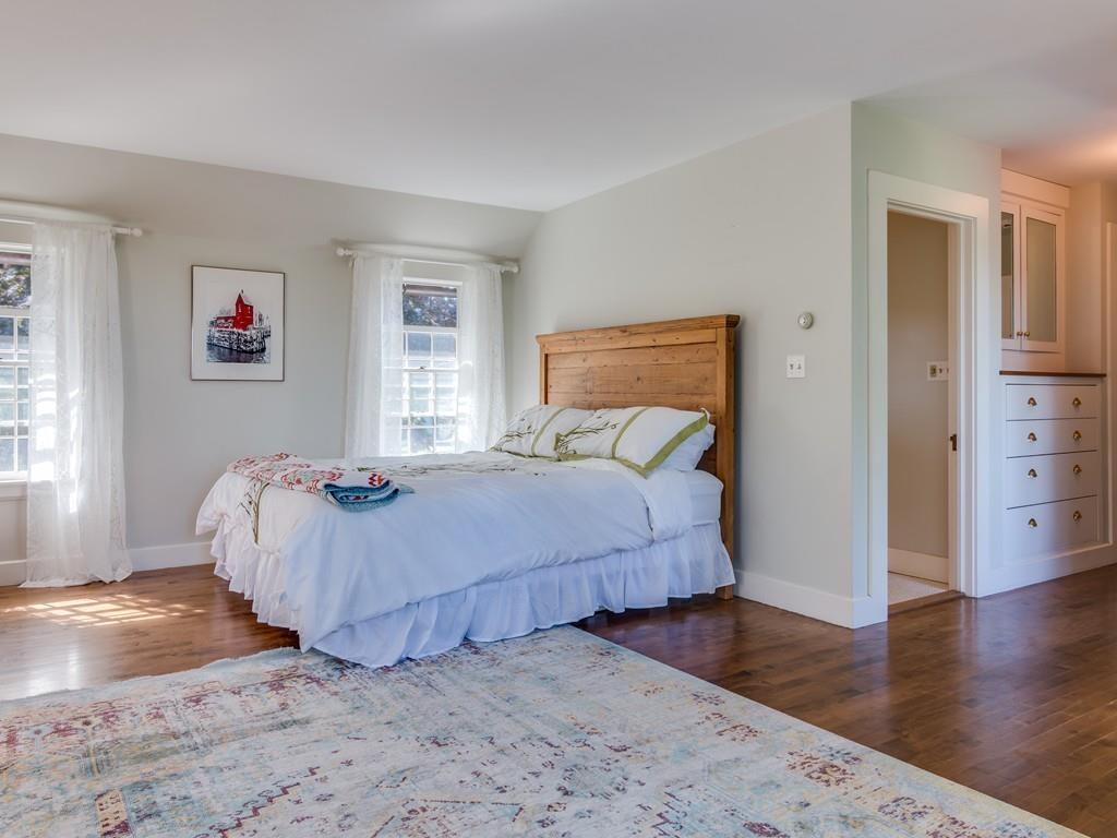 5 Way Road Gloucester, MA 01930 - Photo 15 of 24 a bedroom with a bed and wooden floor