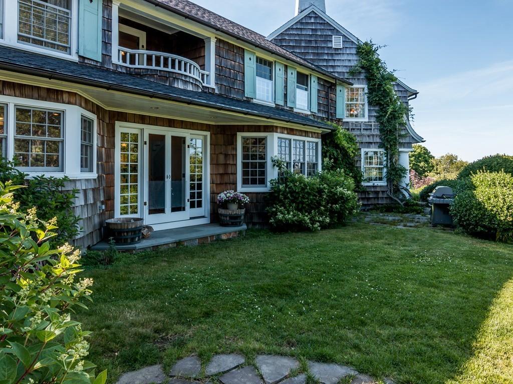 5 Way Road Gloucester, MA 01930 - Photo 2 of 24 a view of a brick building with a yard table and chairs
