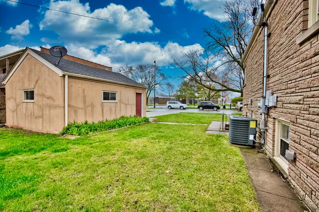 a view of a backyard with plants and a patio