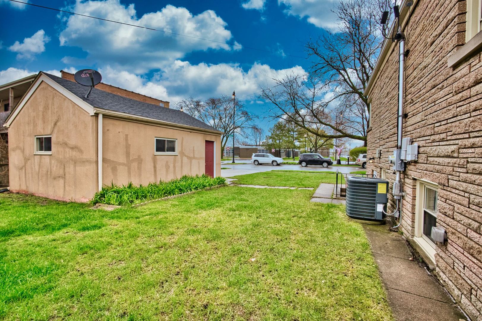 5200 Madison Street Skokie, IL 60077 - Photo 12 of 53 a view of a backyard with plants and a garden