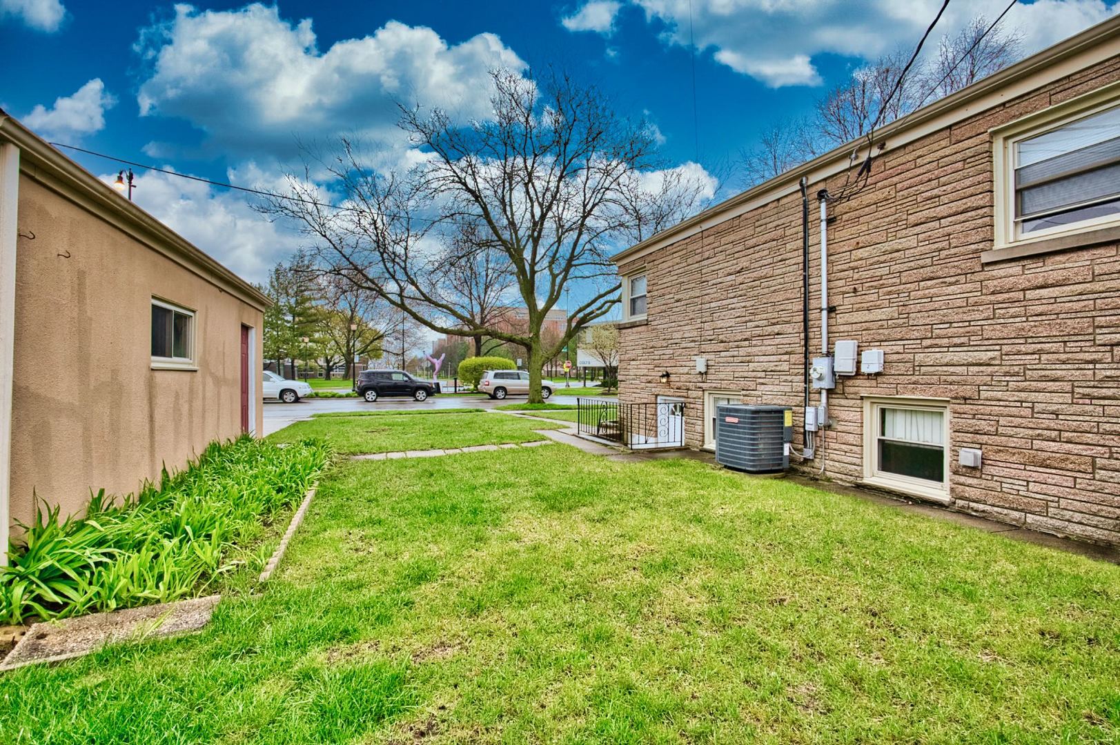 5200 Madison Street Skokie, IL 60077 - Photo 13 of 53 a view of a backyard with plants and a patio