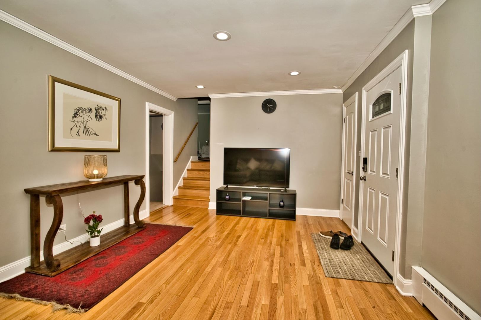 5200 Madison Street Skokie, IL 60077 - Photo 19 of 53 a living room with furniture and a flat screen tv