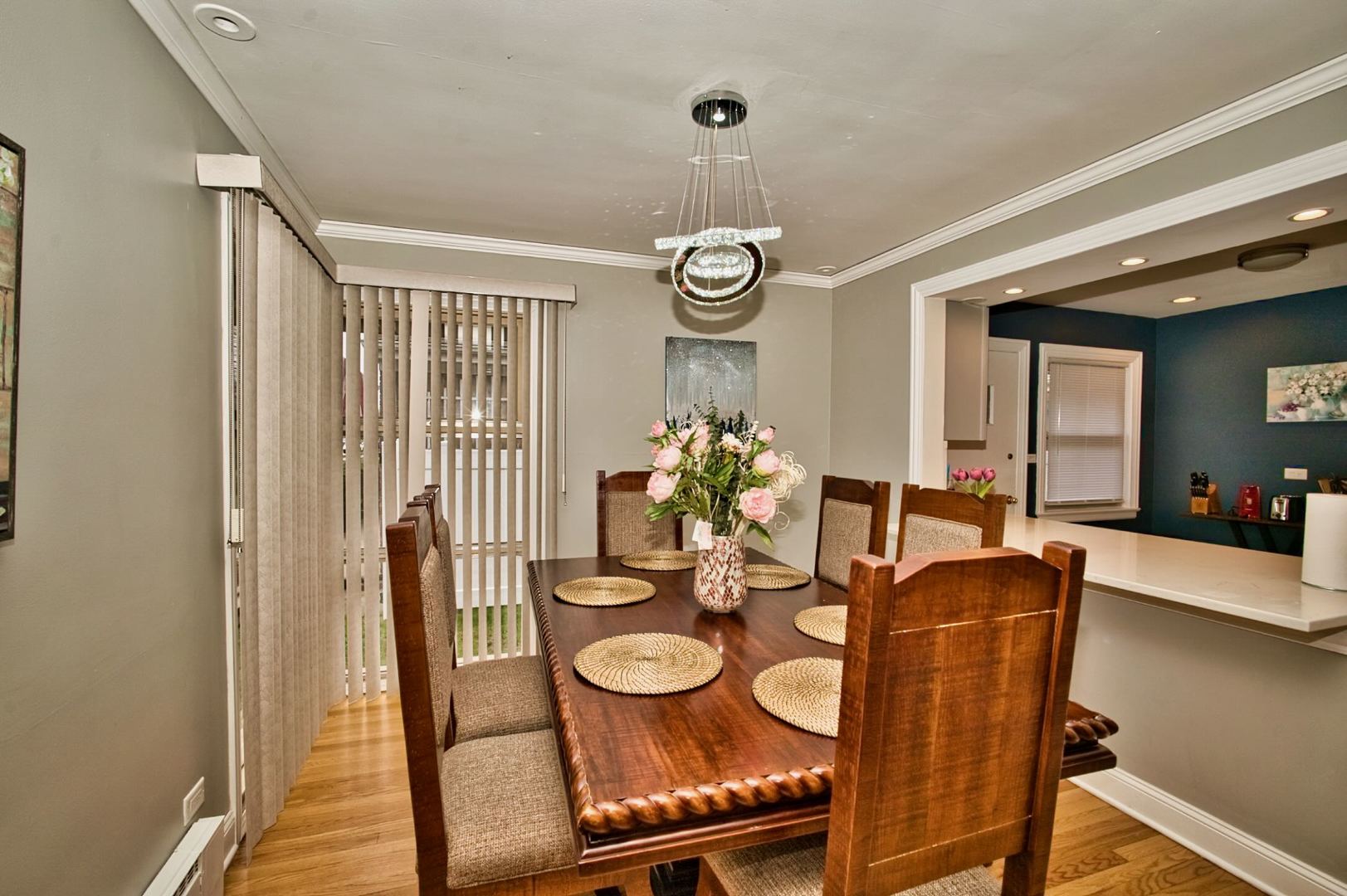 5200 Madison Street Skokie, IL 60077 - Photo 22 of 53 a view of a dining room with furniture and wooden floor