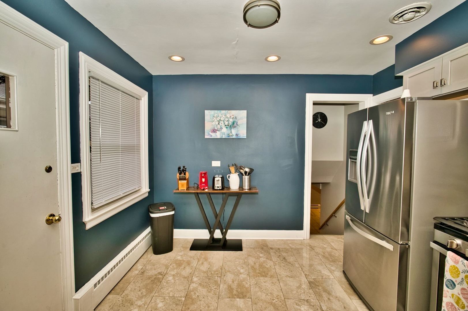 5200 Madison Street Skokie, IL 60077 - Photo 26 of 53 a view of a refrigerator in kitchen and an empty room