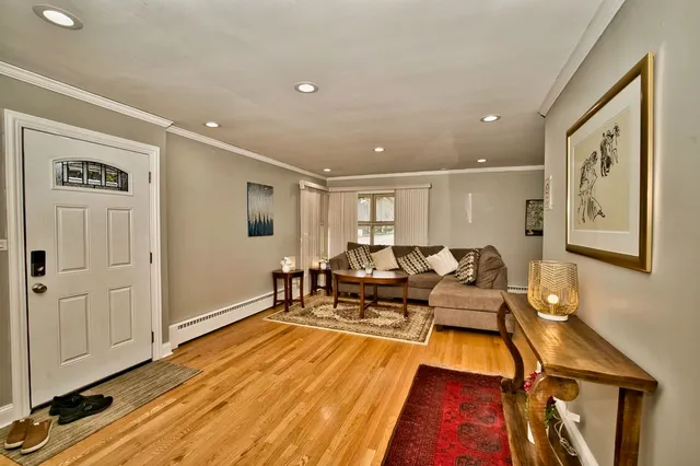 a kitchen with a refrigerator a stove top oven and cabinets