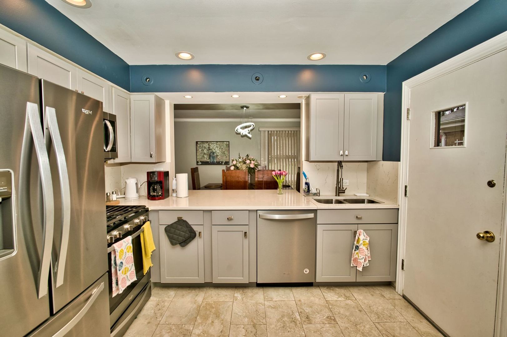 5200 Madison Street Skokie, IL 60077 - Photo 35 of 53 a kitchen with stainless steel appliances granite countertop a refrigerator a stove and a sink