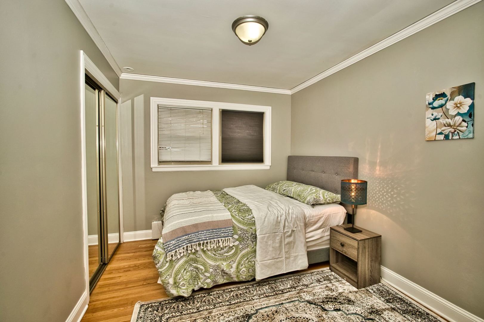 5200 Madison Street Skokie, IL 60077 - Photo 36 of 53 a bedroom with a bed and wooden floor