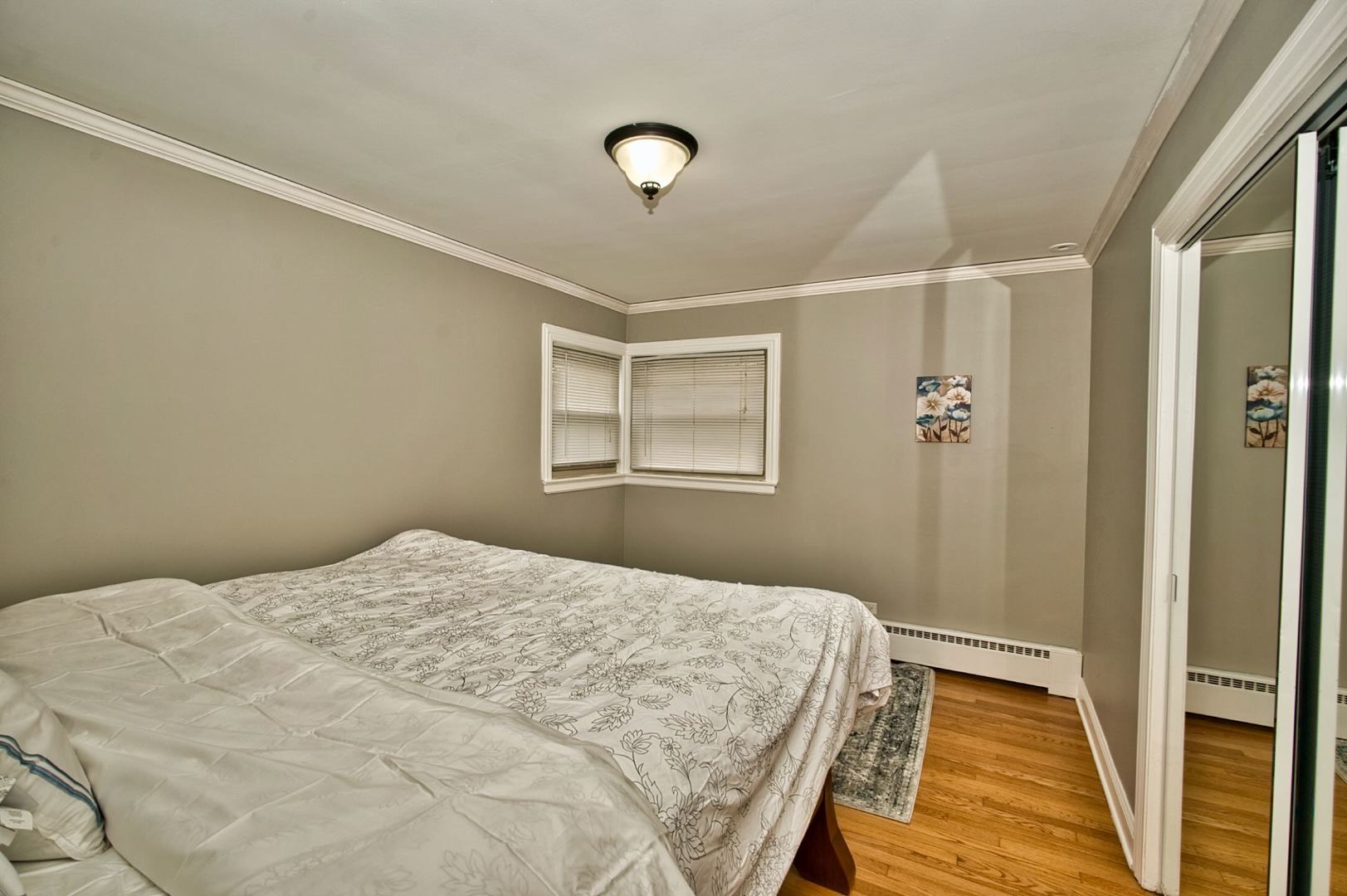 5200 Madison Street Skokie, IL 60077 - Photo 42 of 53 a bedroom with a bed and a window