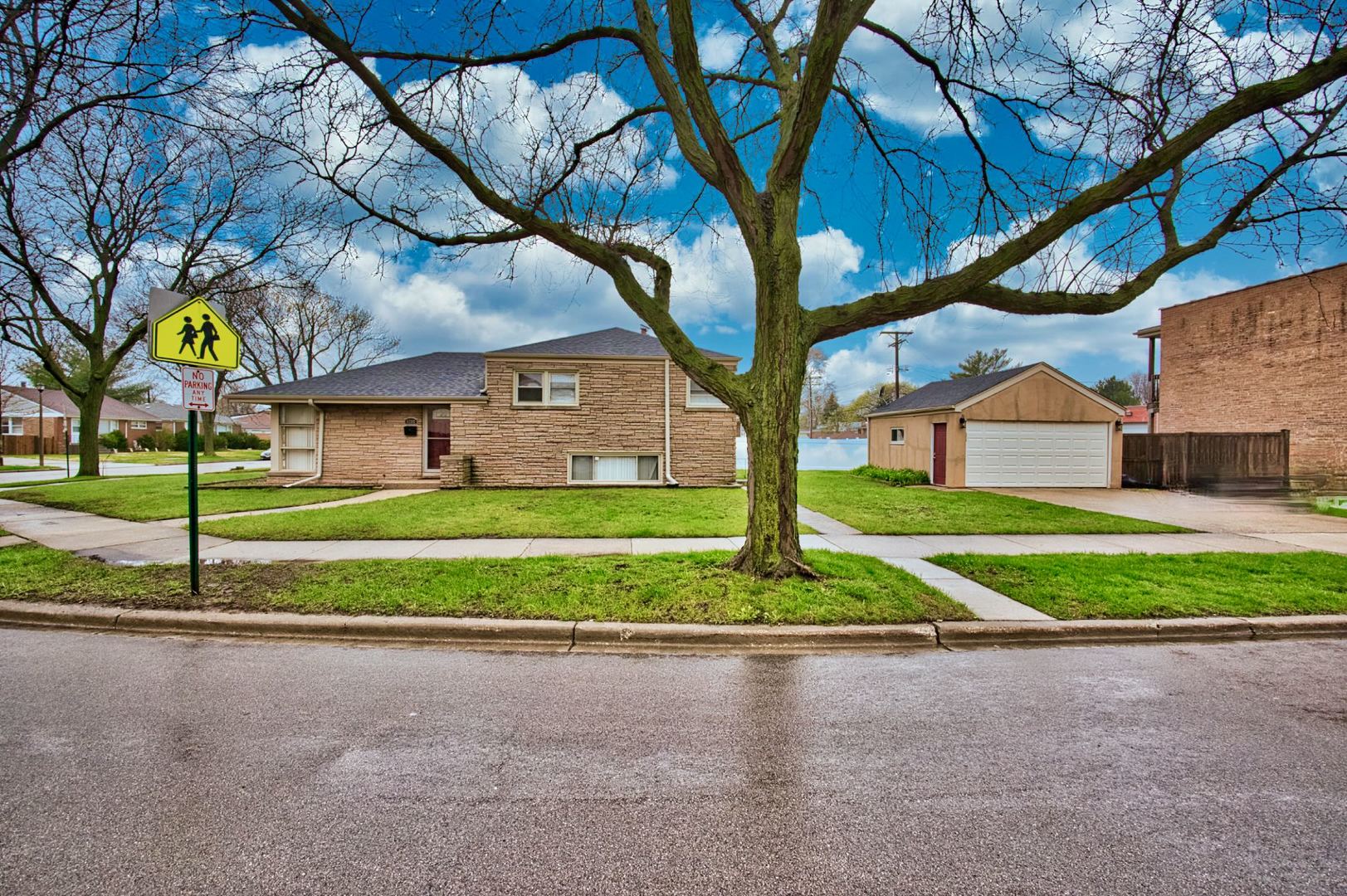 5200 Madison Street Skokie, IL 60077 - Photo 7 of 53 a view of a house with a big yard plants and large trees