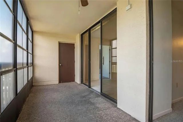 a view of an empty room and window