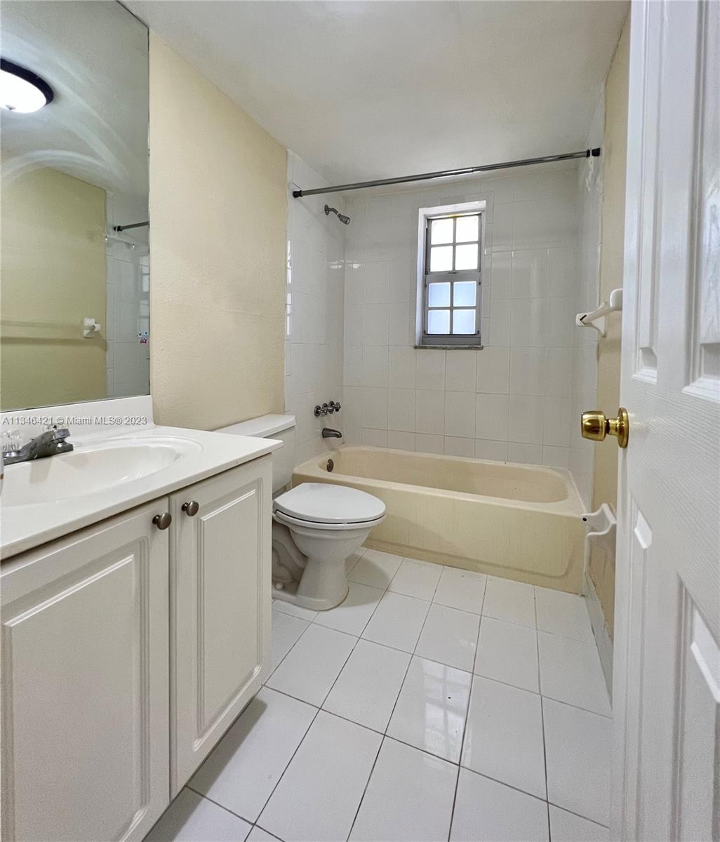 8600 Southwest 109th Avenue, Unit 4209 Miami, FL 33173 - Photo 11 of 15 a spacious bathroom with a granite countertop sink a toilet and shower