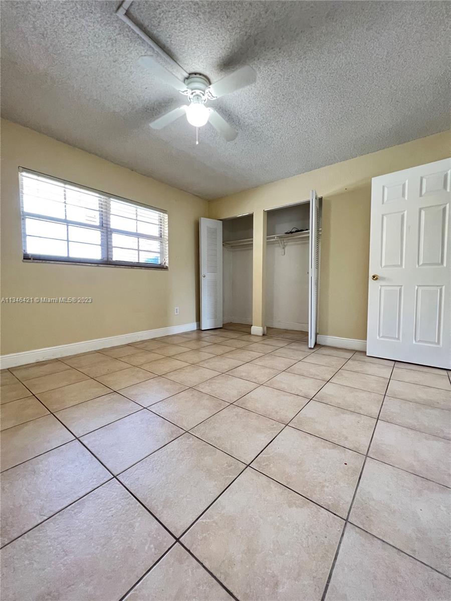 8600 Southwest 109th Avenue, Unit 4209 Miami, FL 33173 - Photo 13 of 15 a view of an empty room with a window