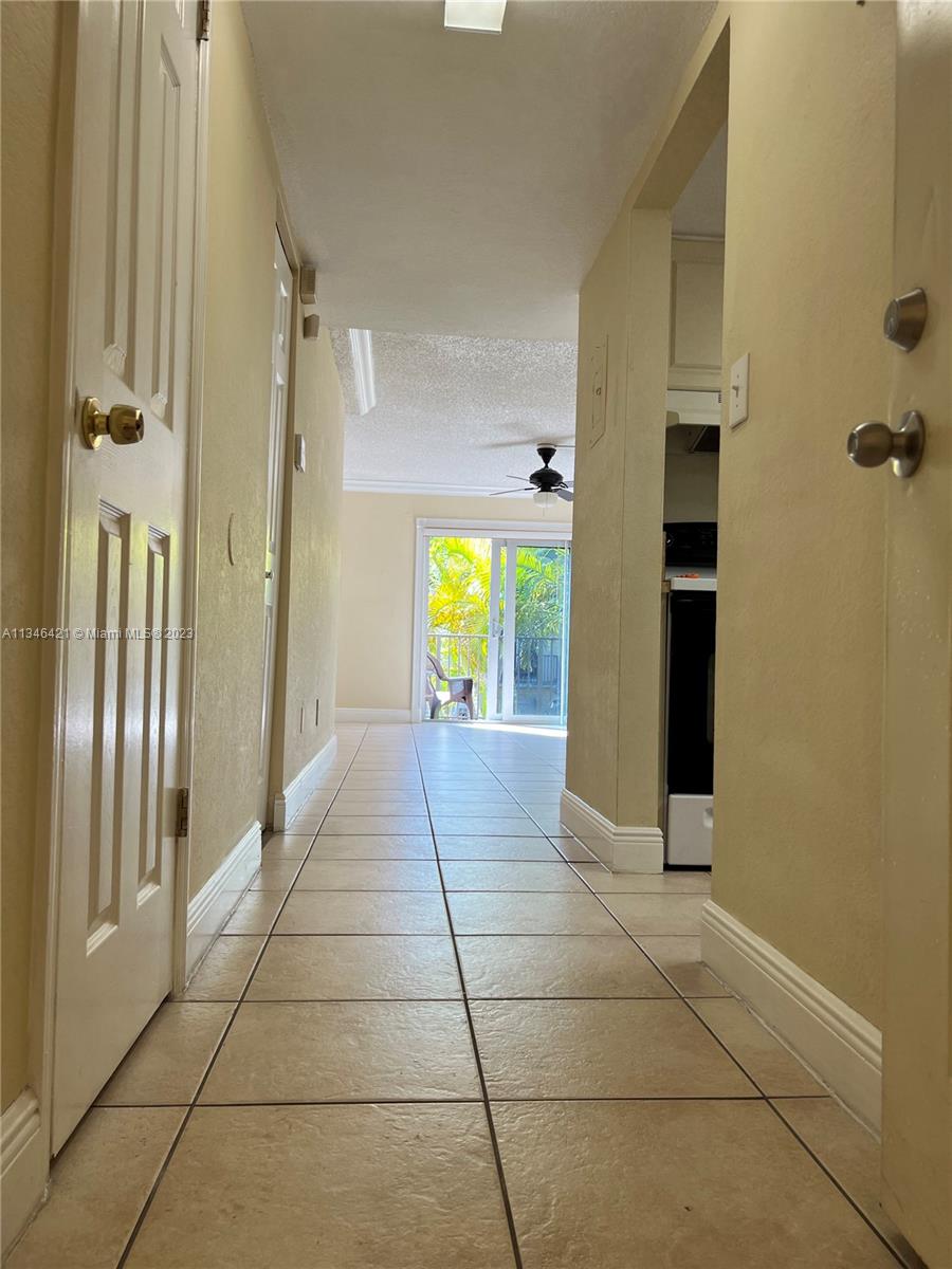 8600 Southwest 109th Avenue, Unit 4209 Miami, FL 33173 - Photo 3 of 15 a view of a hallway with interior of the house