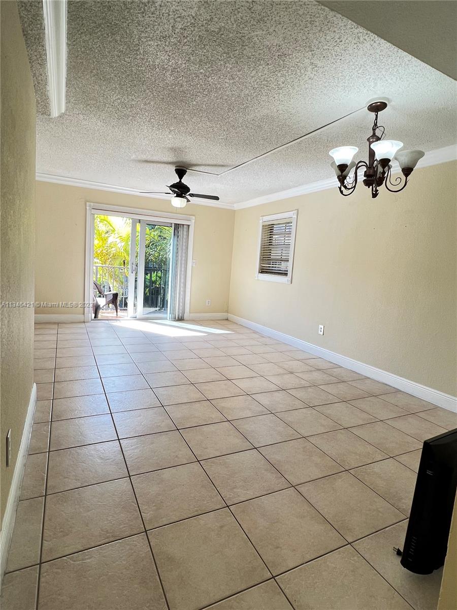 8600 Southwest 109th Avenue, Unit 4209 Miami, FL 33173 - Photo 8 of 15 a view of an empty room with a window