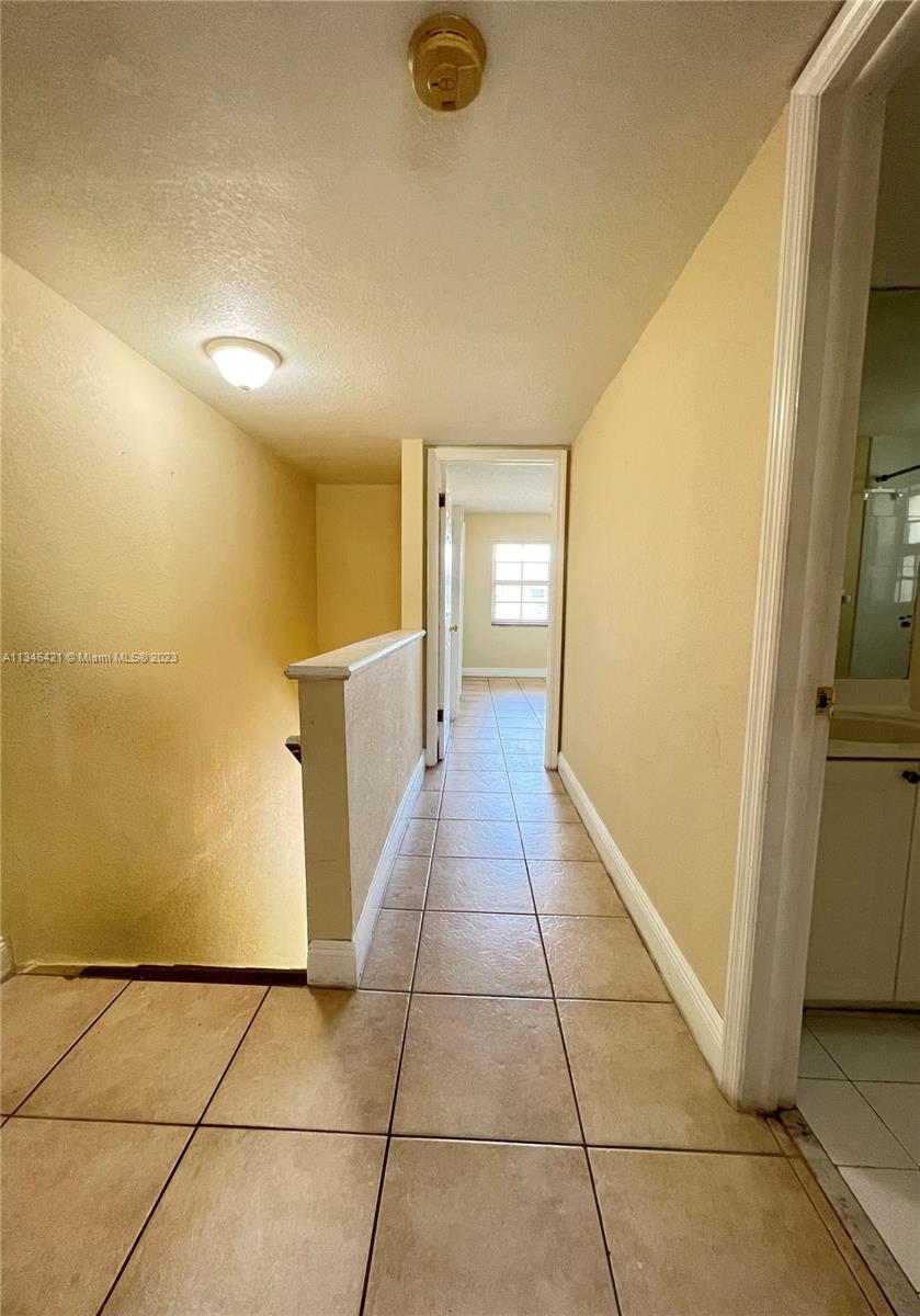 8600 Southwest 109th Avenue, Unit 4209 Miami, FL 33173 - Photo 10 of 15 a view of a hallway to rooms