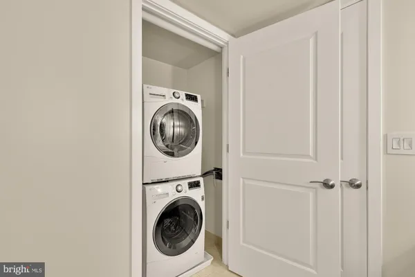 a view of a hallway with washer and dryer