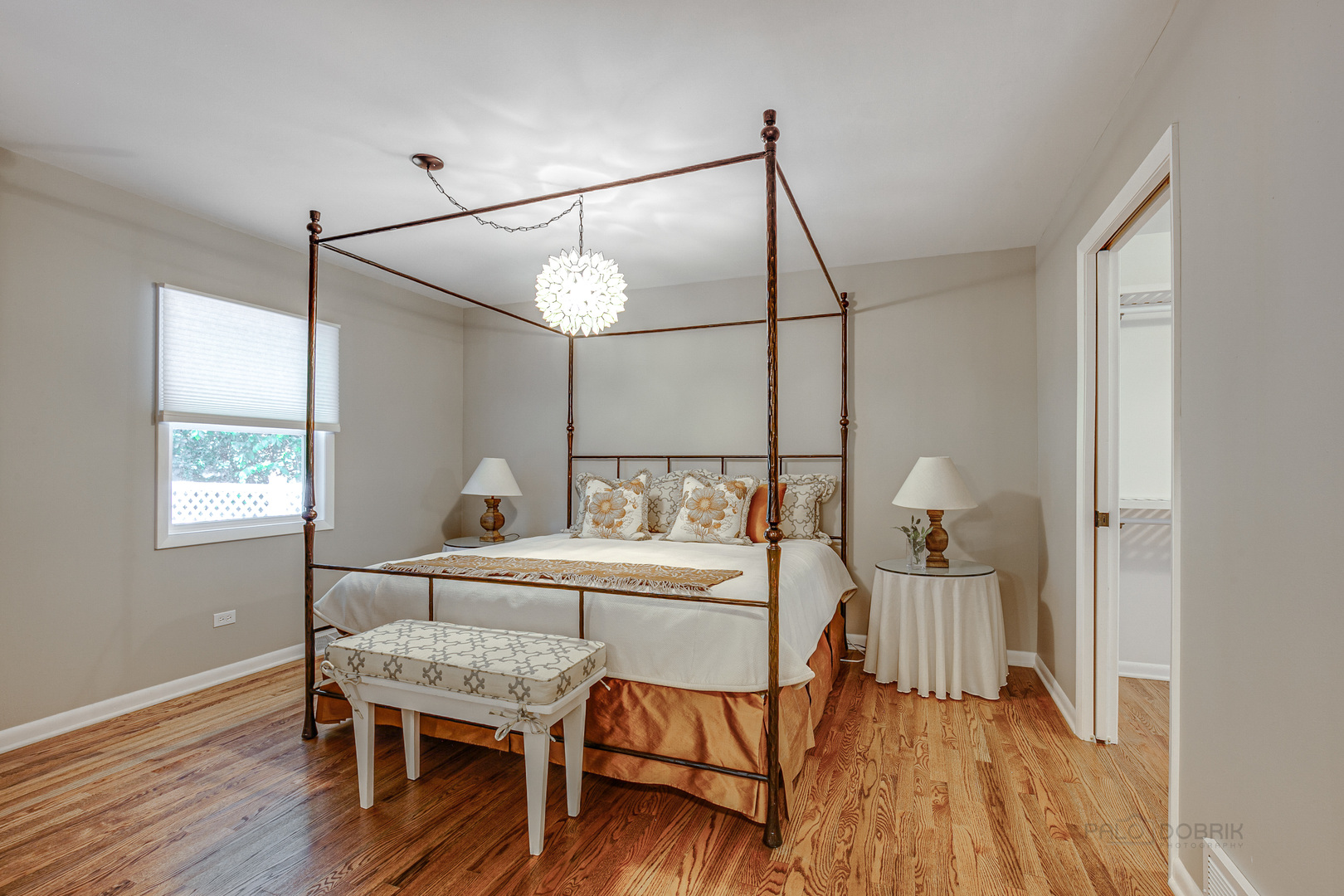 235 Waverly Road Barrington, IL 60010 - Photo 12 of 26 a bedroom with a bed and wooden floor