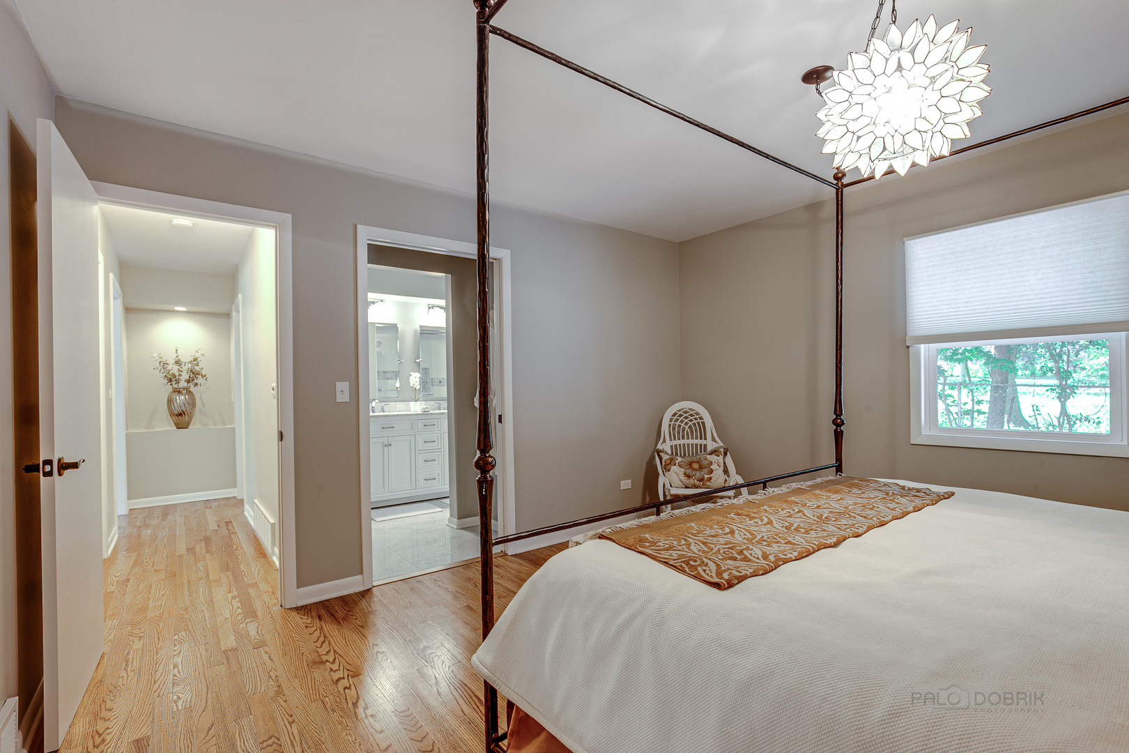 235 Waverly Road Barrington, IL 60010 - Photo 13 of 26 a bedroom with a bed and a chandelier