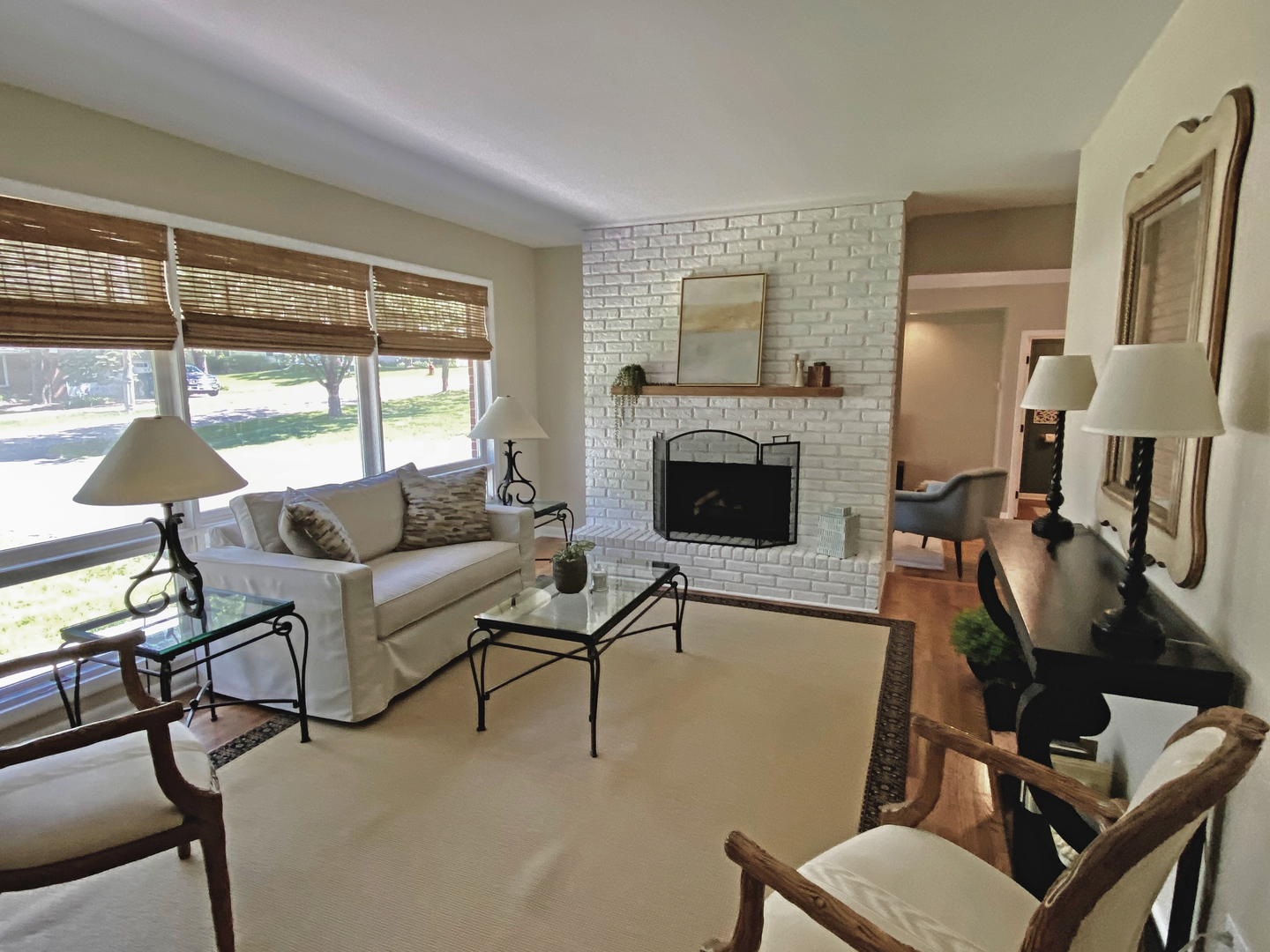 235 Waverly Road Barrington, IL 60010 - Photo 3 of 26 a living room with furniture a fireplace and a floor to ceiling window