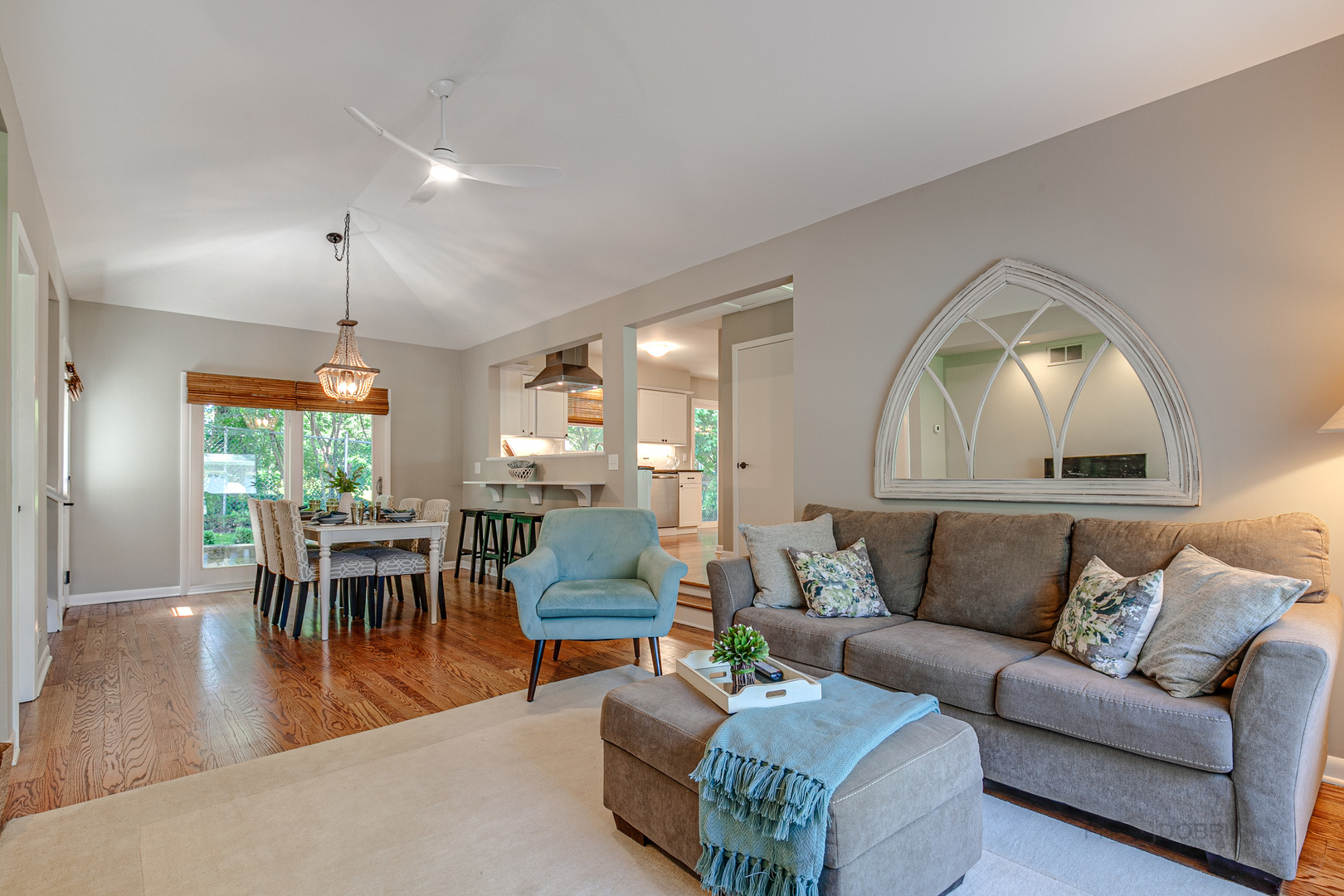 235 Waverly Road Barrington, IL 60010 - Photo 6 of 26 a living room with furniture a dining table and a chandelier