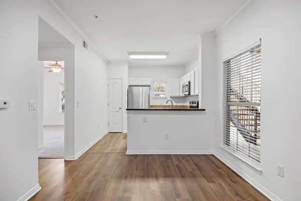 a view of kitchen and wooden floor