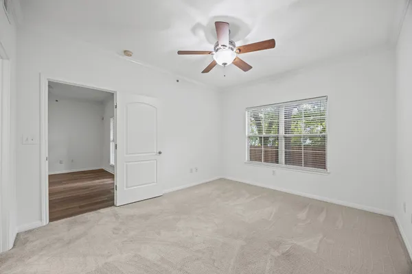 a view of an empty room with a window
