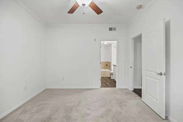 an empty room with a bathroom