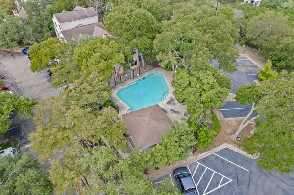 an aerial view of a house with yard and outdoor seating