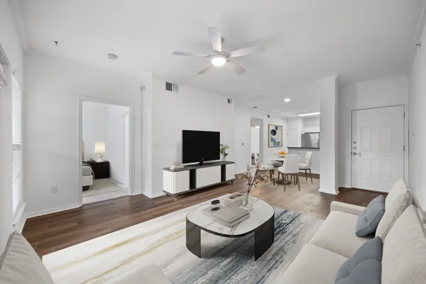 a living room with furniture and a flat screen tv