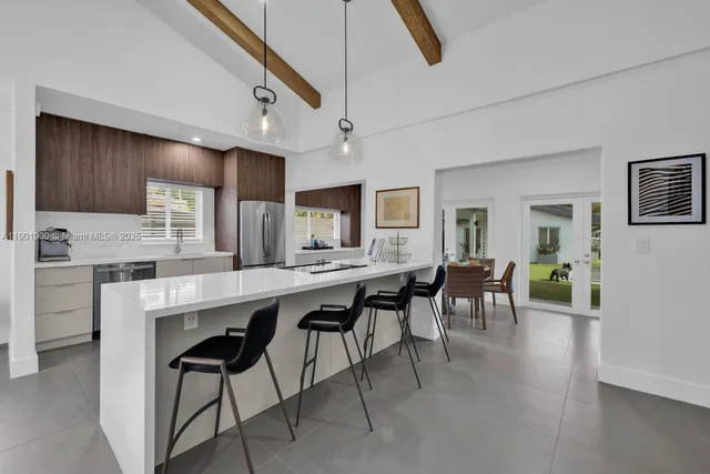 a bedroom with furniture and a flat screen tv