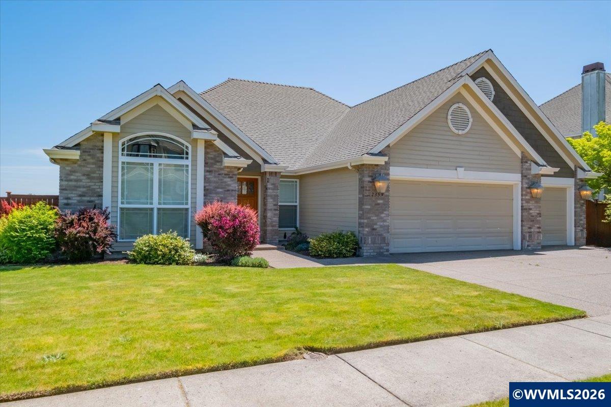 2359 Northwest Gale Street Albany, OR 97321 - Photo 2 of 47 a front view of yellow house with garden