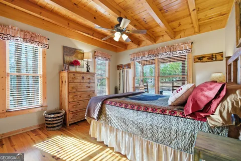 a bed room with a bed and a chair