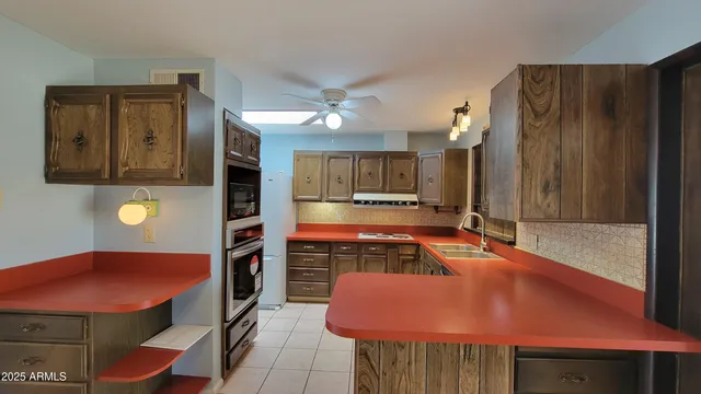 a room with table chairs and a stove