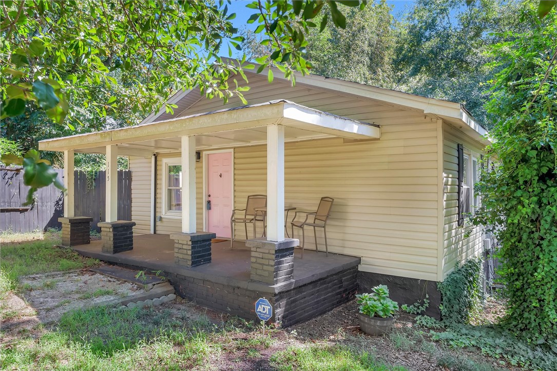 115 May Street Easley, SC 29640 - Photo 2 of 25 A welcoming front porch with classic columns anchors the facade of this charming home.