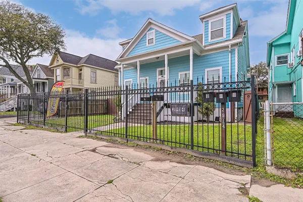 a view of a house with a backyard and a garden