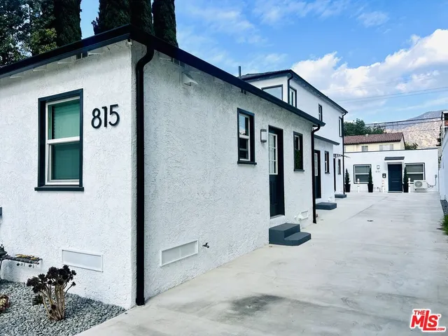 a view of a house with a street
