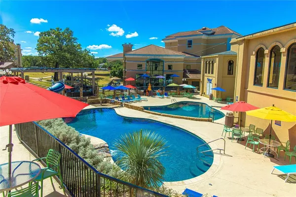 a view of a swimming pool with a patio